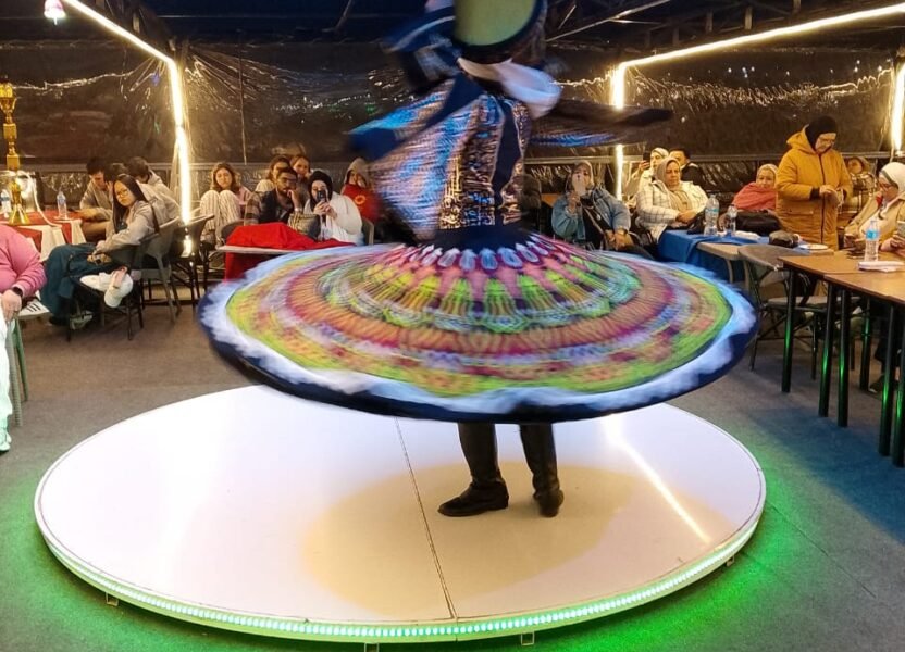 Tanoura dancer spinning a colourful skirt on a Nile dinner cruise in Cairo