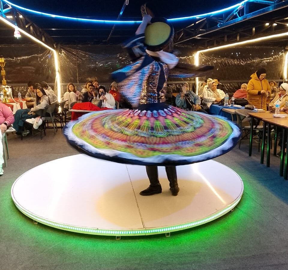 Tanoura dancer spinning a colourful skirt on a Nile dinner cruise in Cairo