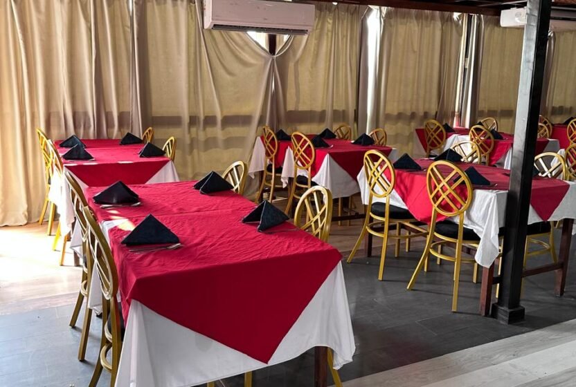 Tables set with red cloths in the Nile cruise restaurant