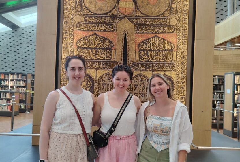 Travellers by a carved doorway in Alexandria