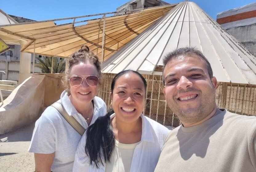 Travellers smiling on a day trip to Alexandria