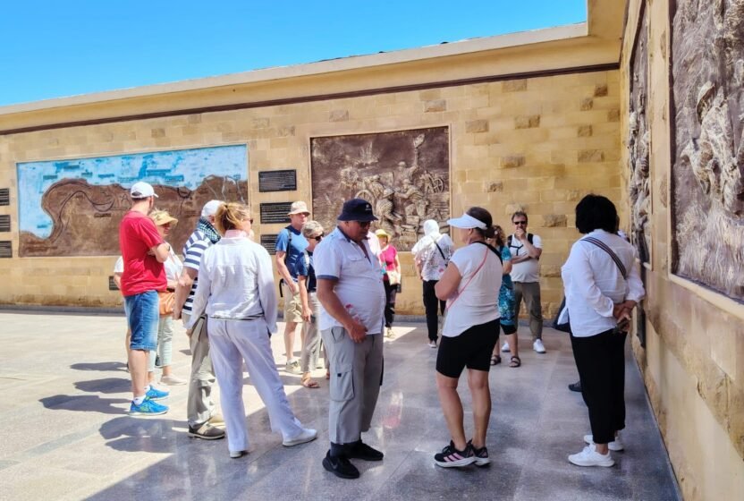 Tour group exploring Alexandria with a guide