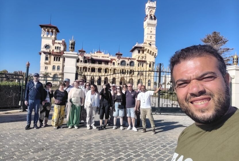 Tour group in front of a historic palace in Alexandria