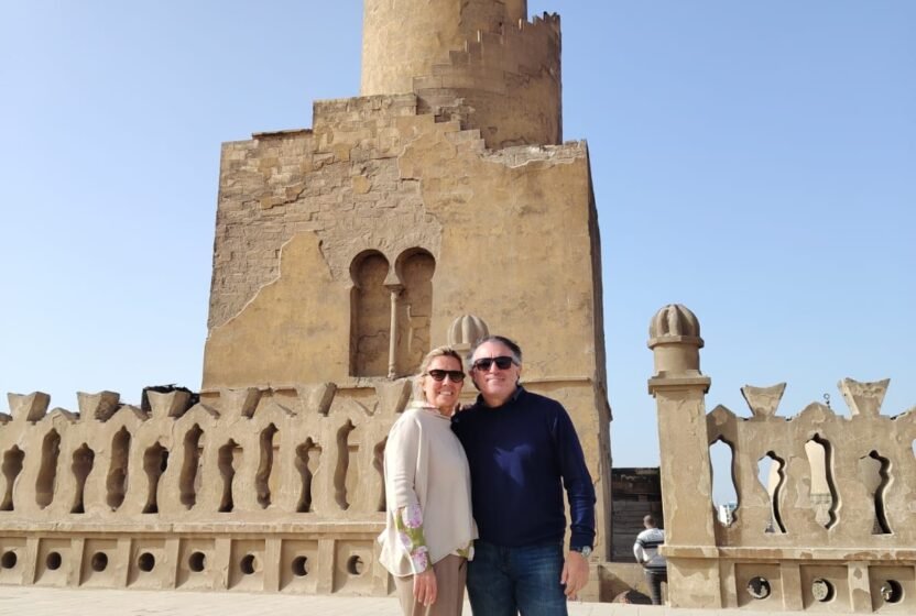 Travellers by the minaret of the Ibn Tulun Mosque