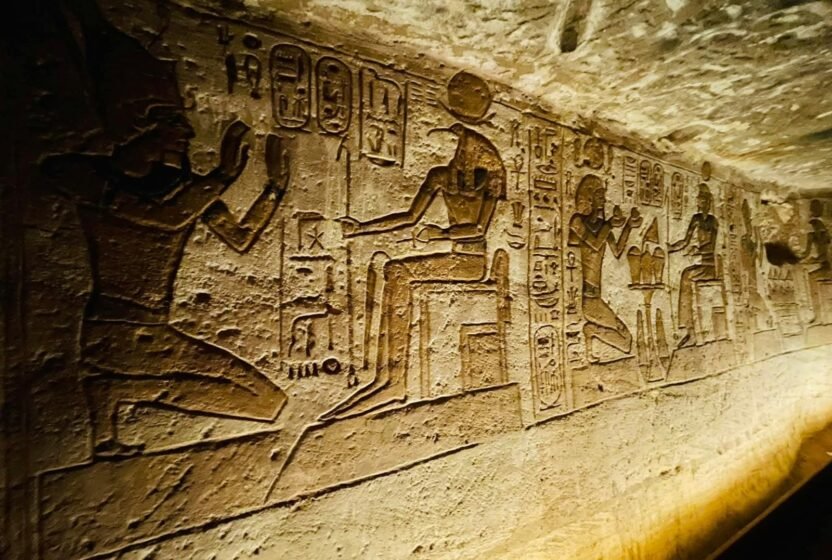 Carved reliefs inside an ancient Egyptian tomb in Luxor