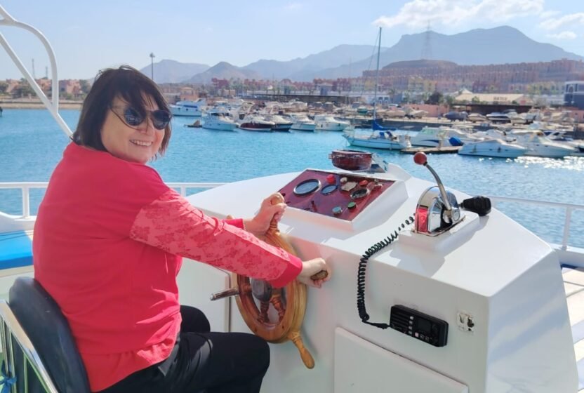 Guest at the helm of the boat at Ain Sokhna